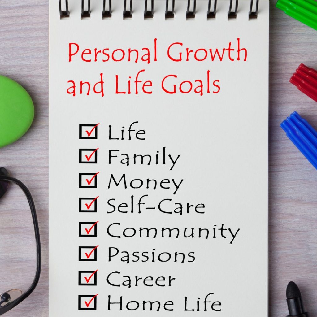 Personal Growth and Life Goals written on a notepad.